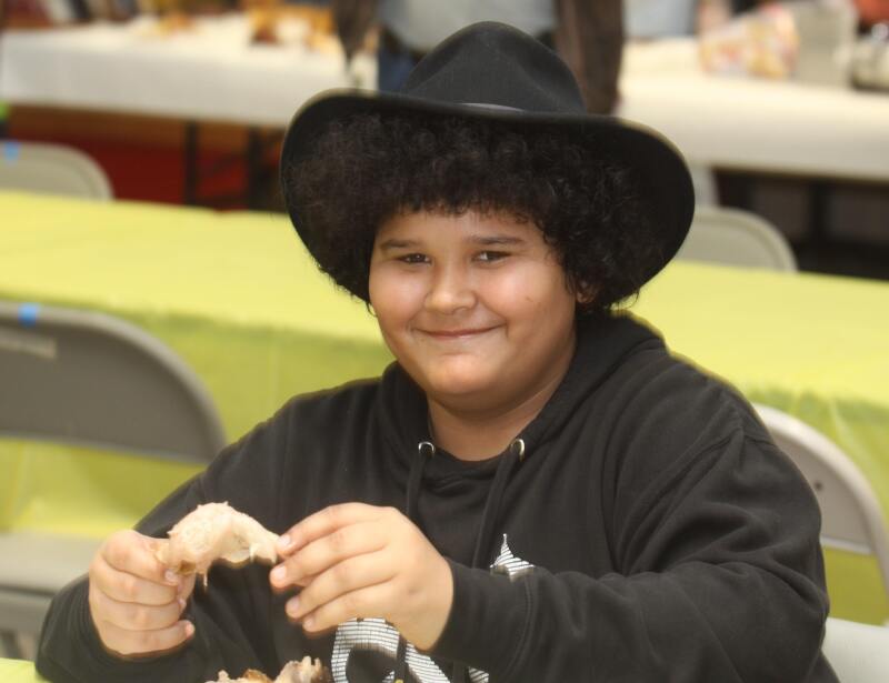 Jordyn Ashe enjoys a Chicken plate at the Teddy Bear Chicken Dinner Fundraiser. 