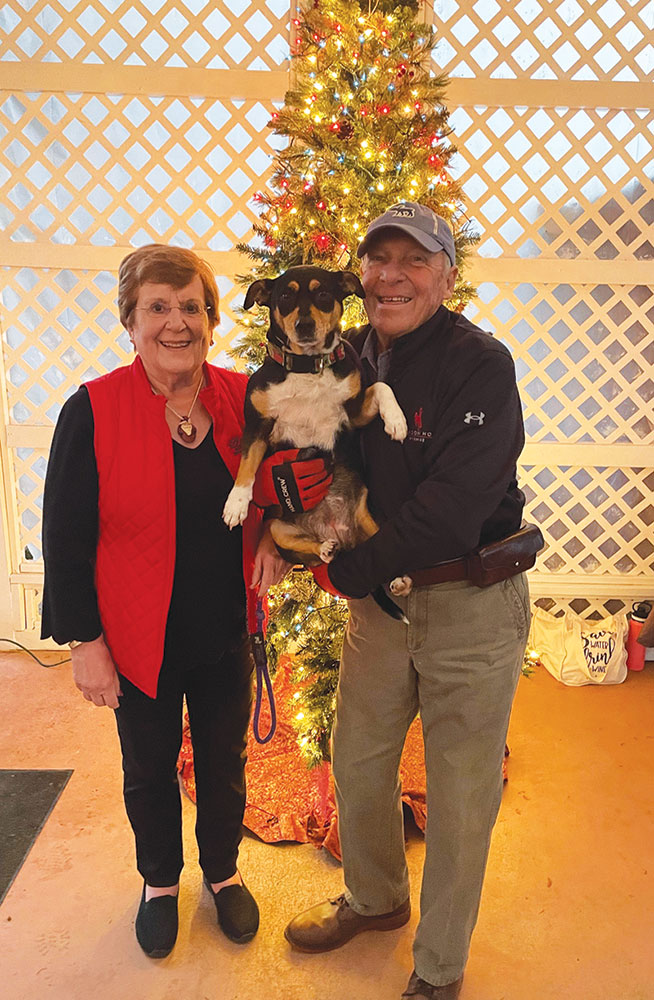 Ann and Charles Edwards are pictued with Beatrice, their rescue dog. They are the owners of Baker Buffalo Creek Vineyard & Winery. The Winery was the 