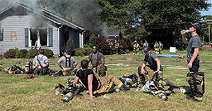 Firemen take a break to cool down and hydrate at the controlled burn 