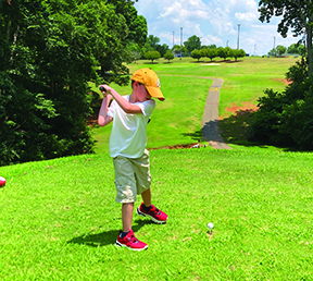 Henry Jernigan rares back to take a swing while teeing off on hole #2 at Royster Memorial Golf Course located at the Shelby City Park.