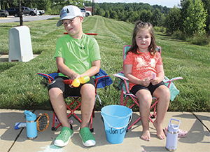 Jon Cole Whisnant and his sister Caroline watch their father Jonathan Whisnant, Deputy Chief of Boiling Springs Fire and Rescue