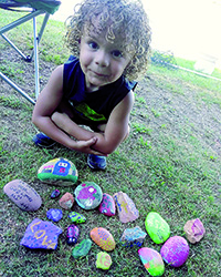 Hiding, hunting painted rocks new pastime 