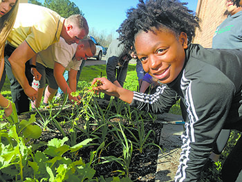 School garden inspires students to try new foods, grow their own food