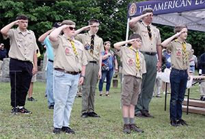 Members of Boy Scout Troop 92 in Kings Mountain salute during the National Anthem