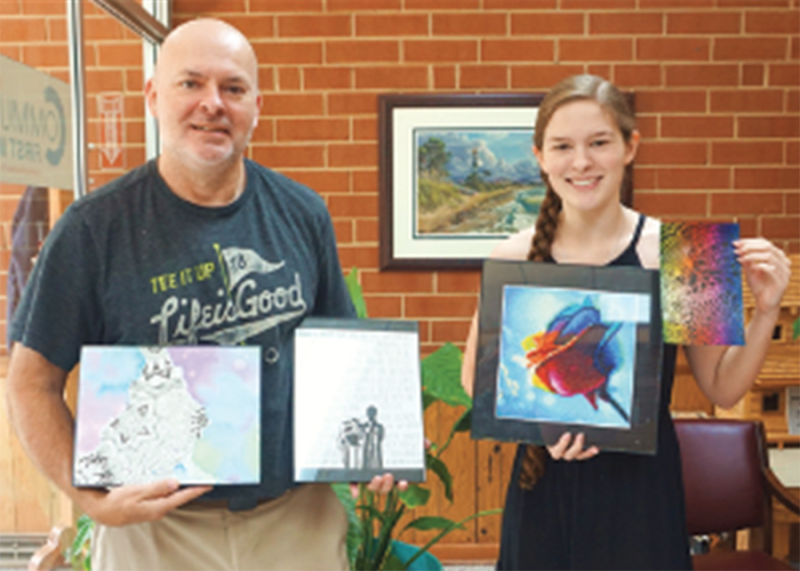 Allie MacArthur and her Dad Noel with some of her art she is wanting to sell to raise money for The Neal Center.