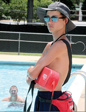 Lifeguard Jacob Kennon keeps an eye on swimmers at the Shelby Aquatic Center at Shelby City Park on July 11th.