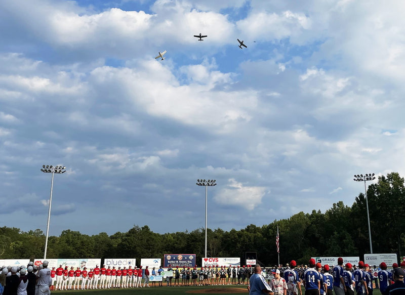 The Warbirds fly over the Parade of  Champions at Keeter Stadium. 