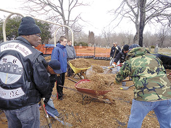 VOLUNTEERS BUILD PLAYGROUND...