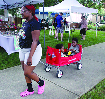 Porsche Parks pulled her sons in their wagon during this year's 18th Annual Art of Sound Festival.