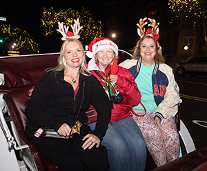 Carol Hartis, Barb McConnor and Marcella Bowan get ready for their horse and carriage ride in Uptown Shelby on Friday, November 27th. For information 