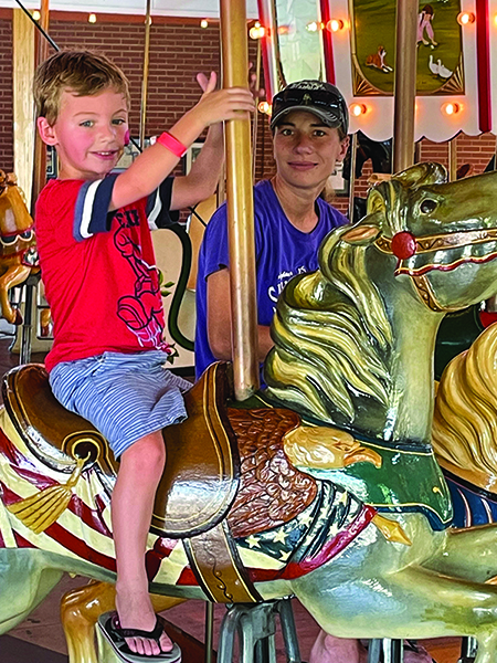 Casein Wellmon rides the Carrousel with his mother Lacy Holland at the National Carrousel Day Celebration at Shelby City Park on July 23rd.  National 