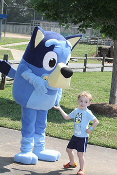 Kolton Harris made friends with Bluey at the Sweet Safe Summer Event at the Shelby City Park. 