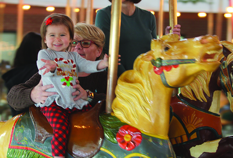 Ava Hanson rides the Carrousel with her aunt Tessie Norman