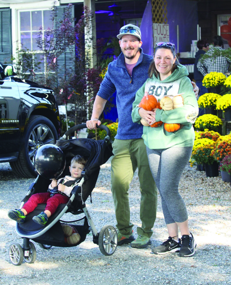 Stephan Eckerman age two, and his parents Ezra and Carly Eckerman shop for some pumpkins at the Cline's Nursery Pumpkin Festival 