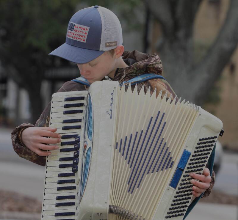 Andrew Smith, age 13, plays the accordion at the Foothills Farmers Market in Shelby