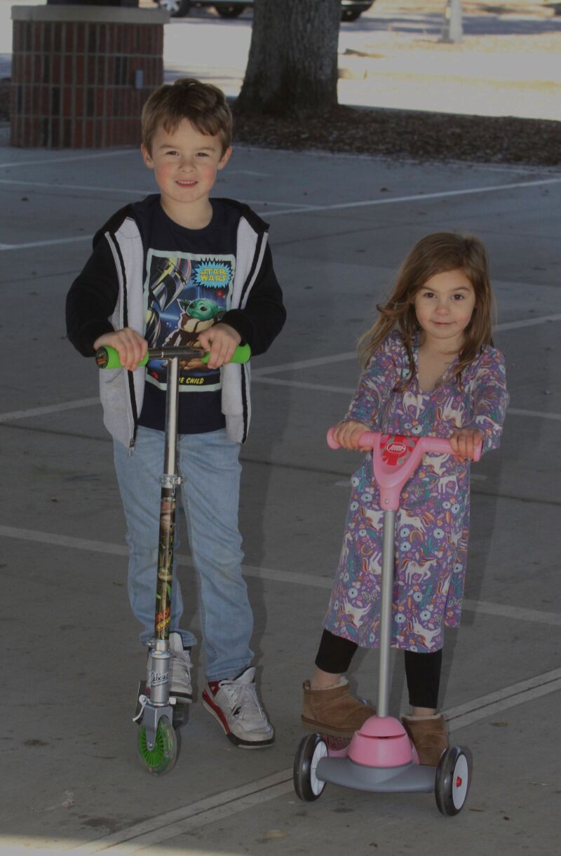 Atlas and Persephone Morrow take a spin on their scooters, they got from Santa, at the Bobby Bell Pavillion in Shelby on 12/31/2023. 