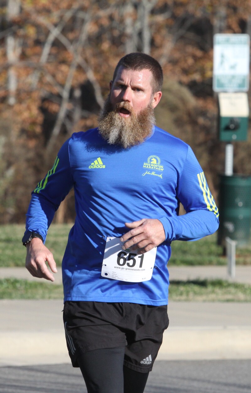 Cale Conley of Shelby crosses the finish line to come in first place in the Hounds of Hanna 5K, at Hanna Park on Saturday  November, 19th 2022.  