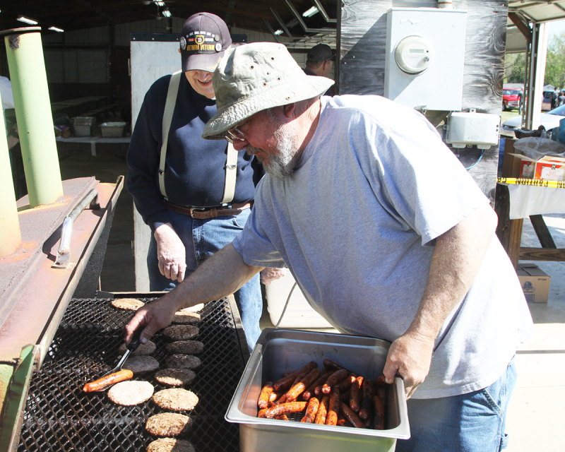 Gary Mellon was in charge of grilling the hamburgers and hot dogs at the Cruising for the Kids Cruise-In and Car Show in Boiling Springs.