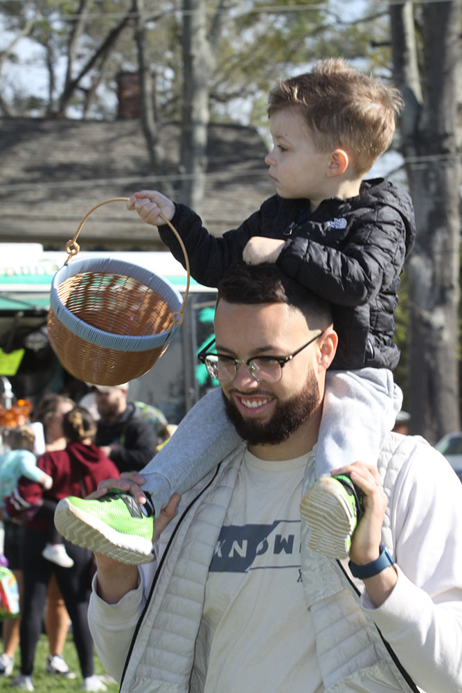 Zach Cox totes his son Zander around at Spring Fest at Patriots Park in Kings Mountain. 