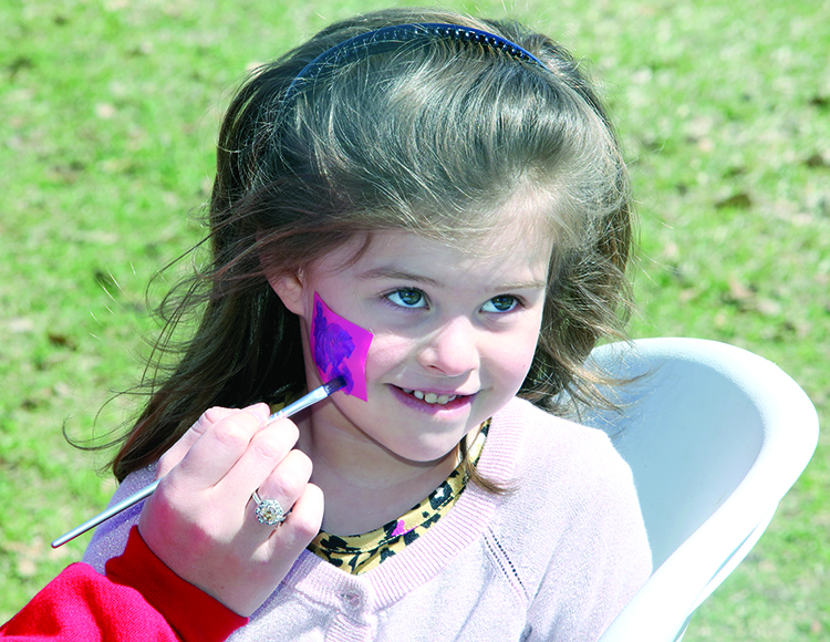 Luna Diadota gets her face painted at the Cleveland County Library Renaissance Fair 