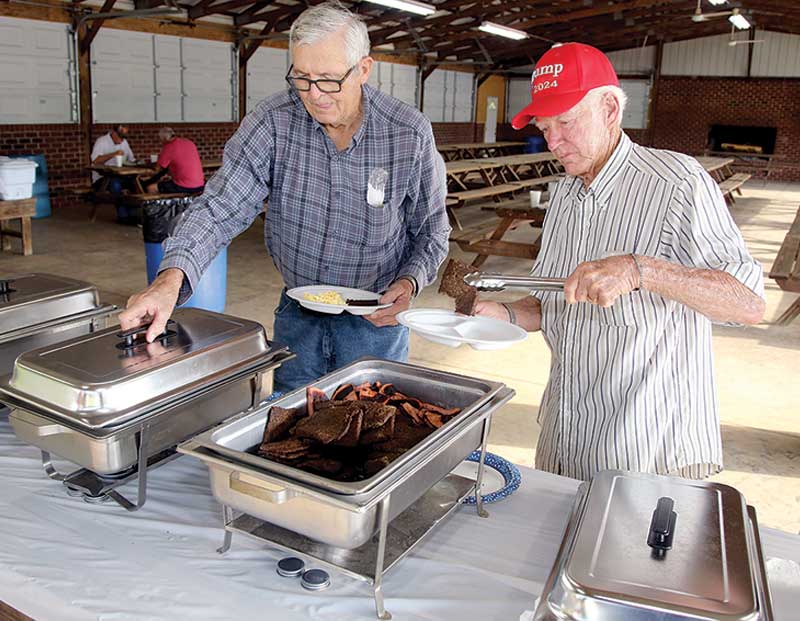 Cecil Mellon and Wayne Moore fix their breakfast plates at the Friendship Masonic Lodge #388 community breakfast that was held Saturday, July 17th.