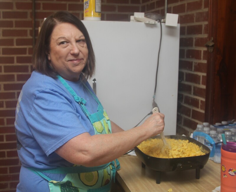 Debbie Mauney is pictured scrambling eggs at the buffet breakfast fundraiser at Pleasant Hill United Methodist Church