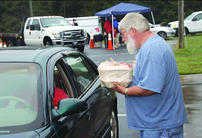 Cicero Terry hands out fish plates at the Annual Piedmont Shrine Club Fish Fry