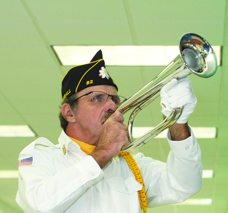 James Baker of the American Legion Honor Guard plays Taps at the Cleveland County Veterans Day Program.    